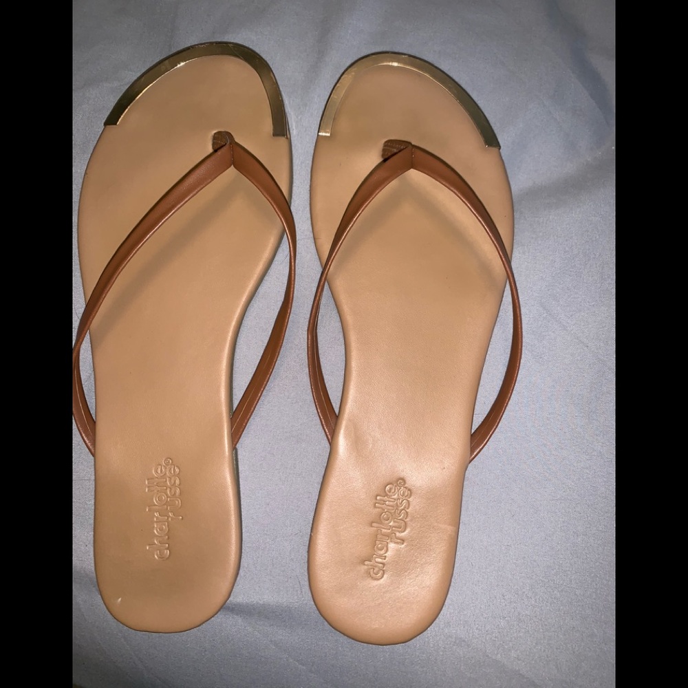 Gold tipped flip flops